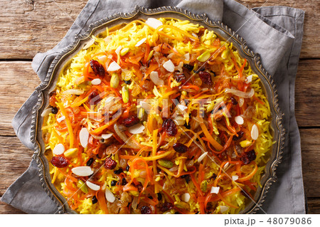 Saffron pilaf with dried fruits, carrots Saffron pilaf with dried fruits, carrots 48079086