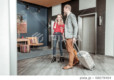 Positive delighted young people being in modern hotel 48079404