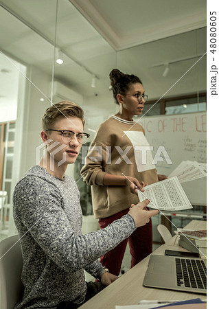 Blonde-haired postgraduate student getting his test result 48080605