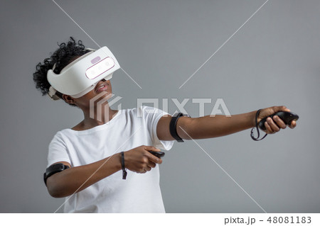 Young african student girl playing with virtual reality glasses. Young african student girl playing with virtual reality glasses. 48081183