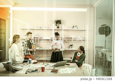 Office workers holding colorful thinking hats sharing their ideas 48081388