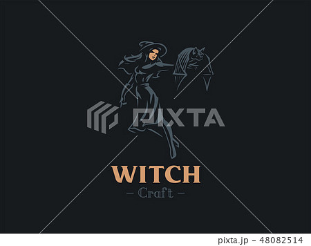 A witch holds a bat in her hand. 48082514