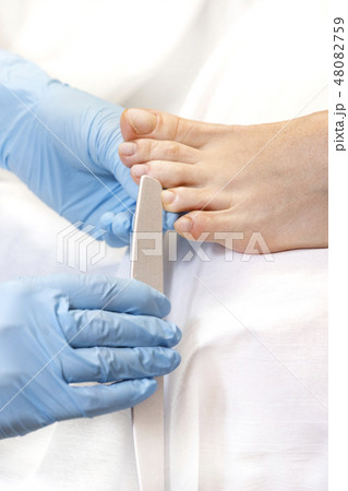 Process of pedicure at beauty salon 48082759