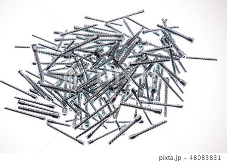 Mound of furniture screws top view on white background Mound of furniture screws top view on white background 48083831