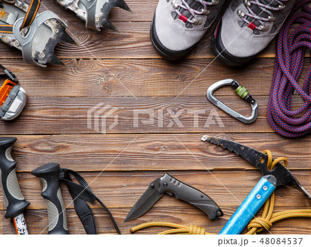 Image on top of ski poles, boots, picks on wooden background. Image on top of ski poles, boots, picks on wooden background. 48084537