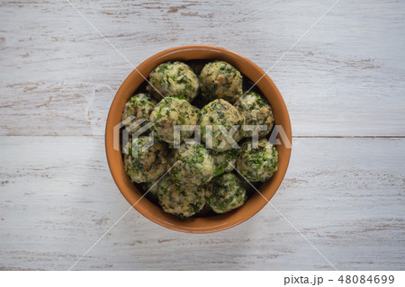 Meatballs with herbs in a clay bowl. Organic food. 48084699