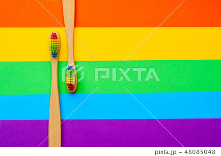 Photo on top of two toothbrushes on side . Photo on top of two toothbrushes on side . 48085048