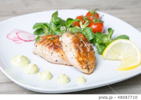 Fried quails, with salad leaves corn and cherry Fried quails, with salad leaves corn and cherry 48087710