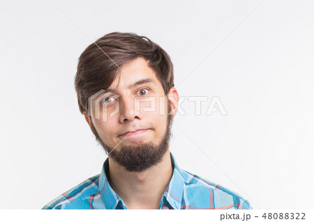 Process, problem, people concept - young man thinking about something on white background Process, problem, people concept - young man thinking about something on white background 48088322