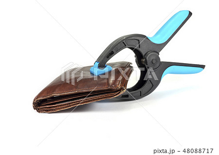 Old leather wallet held by a clasp 48088717