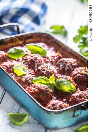 Meat beef balls with basil in vintage roaster pan. Meat beef balls with basil in vintage roaster pan. 48090168