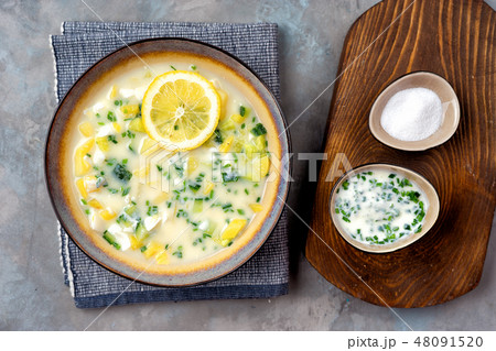 Kefir summer cold soup on wooden table. Okroshka. Kefir summer cold soup on wooden table. Okroshka. 48091520