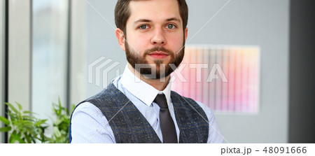 Handsome smiling bearded clerk man at workplace 48091666