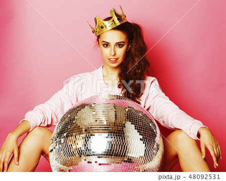 young cute disco girl on pink background with disco ball and crown 48092531
