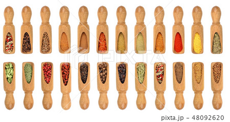 mix of spices in wooden scoop isolated on a white background. Top view. Flat lay. Set or collection 48092620