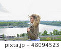 Attractive young woman near the river 48094523
