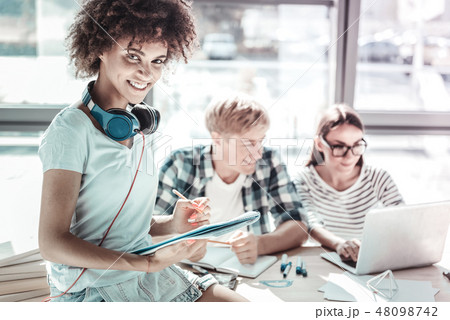 Cheerful Afro-American female looking at camera 48098742
