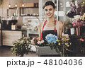 Portrait of beautiful girl florist in flower shop 48104036