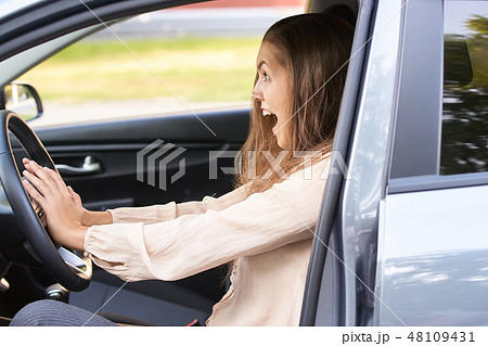 Young woman in car. Ride instruction accident 48109431