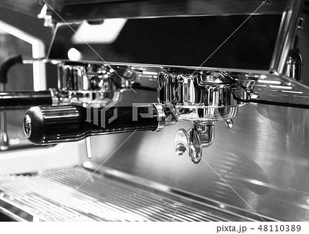Espresso shot from coffee machine in coffee shop Espresso shot from coffee machine in coffee shop 48110389