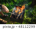 BBQ with wood on the green grass. View from above. 48112299