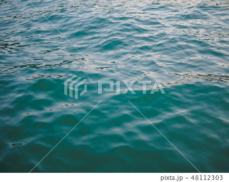Sea water at sunset day turquoise color 48112303