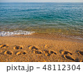 Footprints on the sea sand. Sea shore 48112304