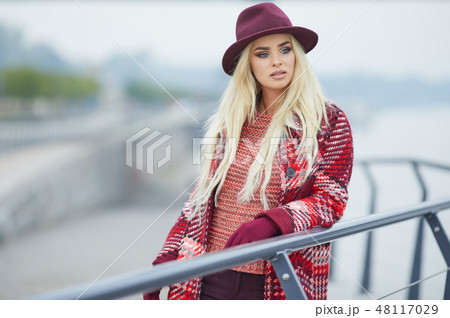 Close up portrait of elegant pretty blonde woman posing at autum Close up portrait of elegant pretty blonde woman posing at autum 48117029