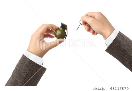 Hand pulls a check from a grenade 48117379