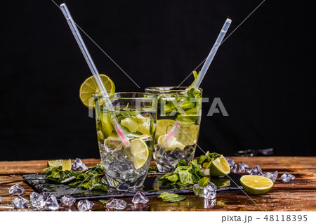 Glasses with drink and spoons Glasses with drink and spoons 48118395