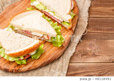 Fresh burgers on wooden board 48118491