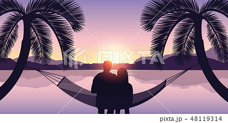 couple in a hammock enjoys the sunset on the beach 48119314