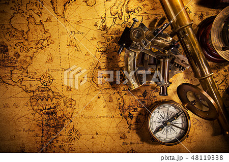 Old vintage navigation equipment on old world map. 48119338