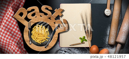 Symbol of Italian Pasta on a kitchen table 48121957
