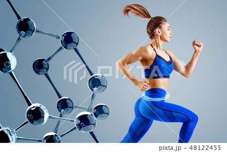 Sporty young woman runing and jumping near glass molecules. 48122455