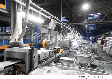 Workers perform their tasks in the shop production plant Workers perform their tasks in the shop production plant 48124026