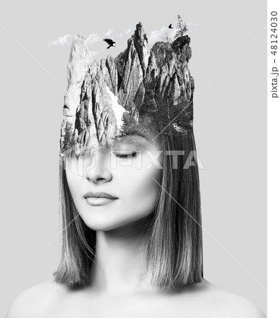 Double exposure of young woman combined with snowy mountain. 48124030