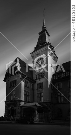 Town hall of Geneva's 'Eaux-Vives' quarter with its clock tower. In black and white color Town hall of Geneva's 'Eaux-Vives' quarter with its clock tower. In black and white color 48125553