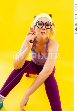 Woman feeling satisfied while eating favorite sweet candy Woman feeling satisfied while eating favorite sweet candy 48127003