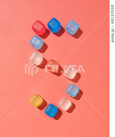 Figure five pattern from colored plastic ice cubes on a background in a color of the year 2019 48132030