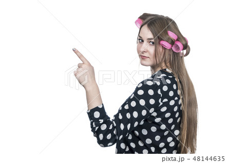 Girl points up and sideways 48144635