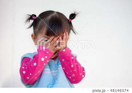 asian girl closing her face and playing peekaboo 48146374