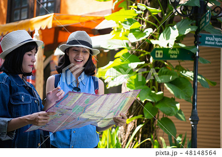 Travel Concept. Beautiful girls are happy to travel. Beautiful g Travel Concept. Beautiful girls are happy to travel. Beautiful g 48148564