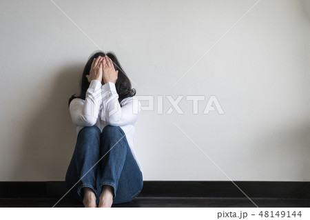 Stressful woman sitting sadly emotional depression 48149144