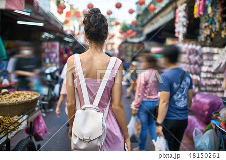 Attractive woman walking on street market in Thailand 48150261
