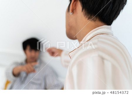 Gay couple having argument at home Gay couple having argument at home 48154372