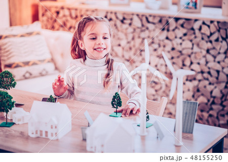 Young woman building toy town for the school 48155250
