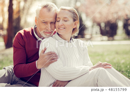 Tender blonde female person sitting near her husband Tender blonde female person sitting near her husband 48155799