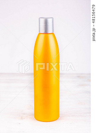 An orange bottle for liquids on a white background An orange bottle for liquids on a white background 48156479