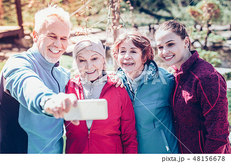 Bearded retired man making selfie with his sport group Bearded retired man making selfie with his sport group 48156678